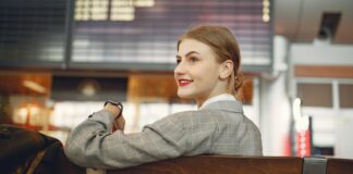 Woman Playing Crossword Puzzle in Airport Before Flight