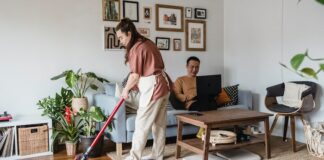 Woman Using Cordless Vacuum