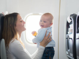 Woman Traveling With Baby and Essentials