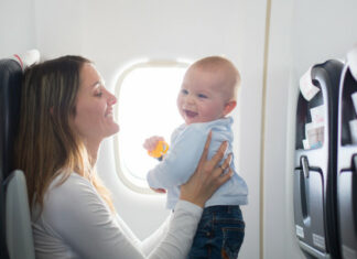 Woman Traveling With Baby and Essentials