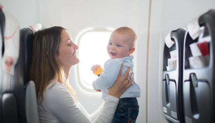 Woman Traveling With Baby and Essentials